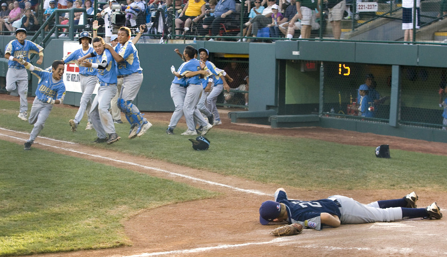 Pearland would lose 10-0 to Hawaii as Jaron Roblyer (22) lies on home plate after Hawaiis Ezra Heleski scored the game-winning run during the fifth inning to put the ten run rule into effect and end Pearland's world championship dreams.