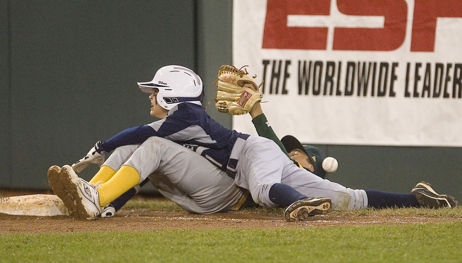 Game 3 against Northwest would prove more of a stretch for the Pearland Little League losing 7-4.  Pearlands Pryce Beshoory reaches for first base over Northwest Hudson Byorick during the third inning. 