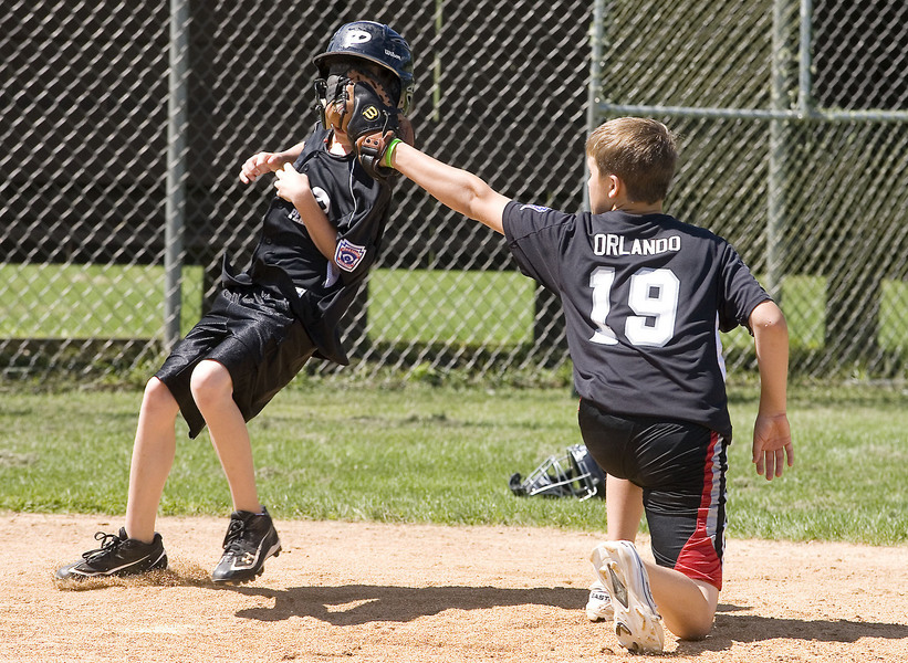 Pearland's Jake Orlando is a little high on the tag on Caleb Maly during a practice.