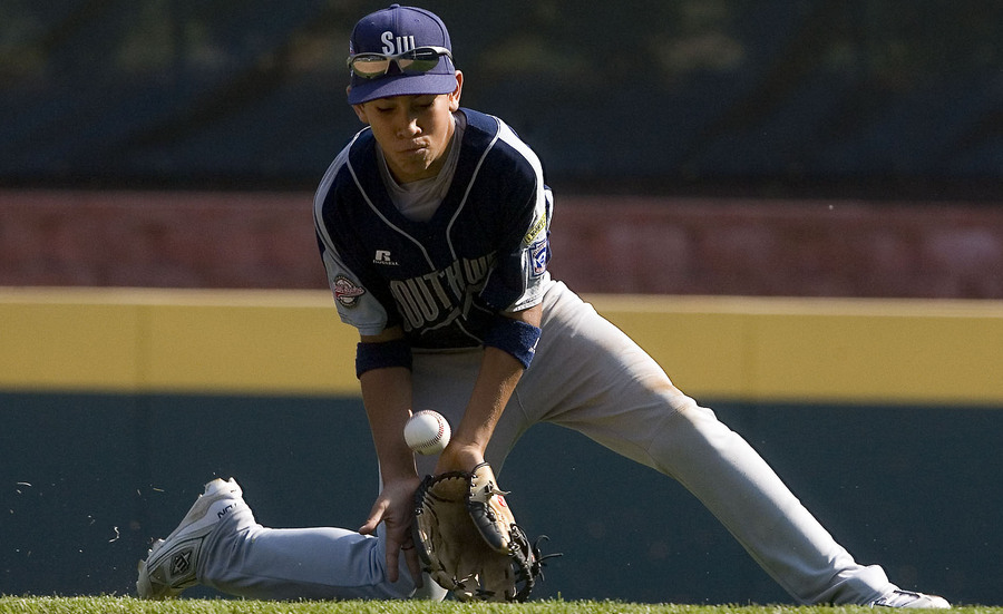 Pearland second baseman Jorge Gutierrez fields a ground ball in  the bottom of the third during game 1 against Midwest.  Pearland would go on to win 10-8.