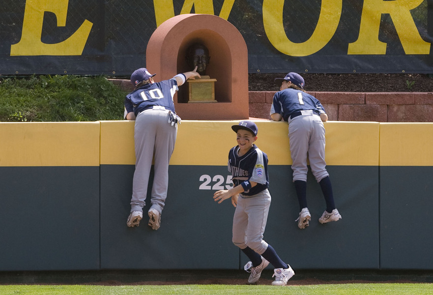 Pearland center fielder Matthew Bettencourt (10), third baseman Blake Toler (5), and second baseman Pryce Beshoory (1), ran out to center field before each game to touch the Howard J. Lamade statue for good luck. 
