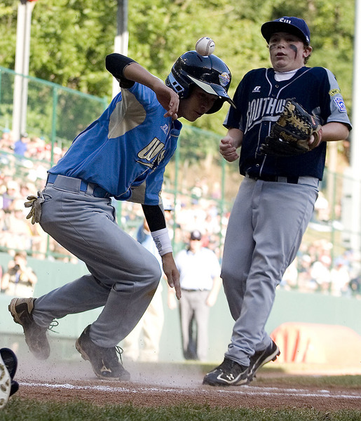 Pearland would have their hands full during the American Championship game as Hawaii's Noah Shackles scores on a pass ball from pitcher Beau Orlando during the third inning.